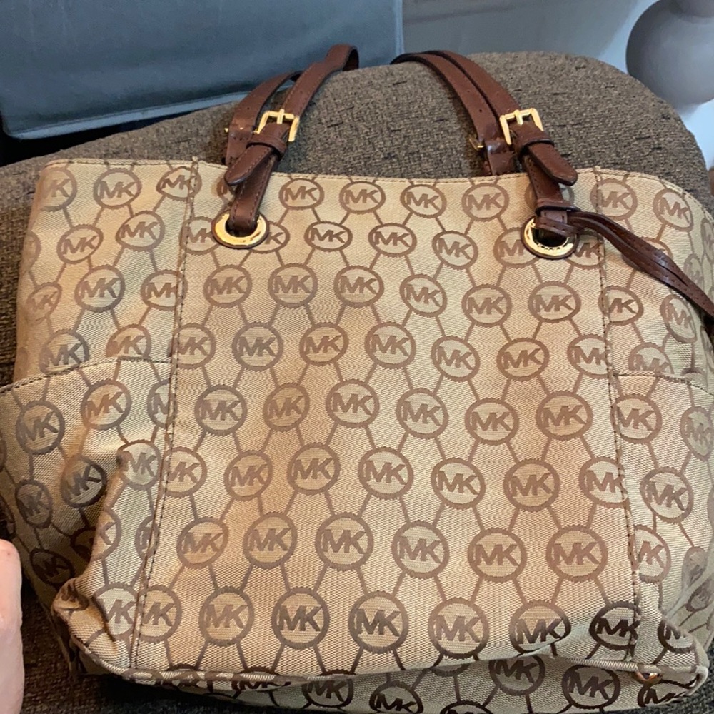 Michael Kors bag only used 3 times. Well take care of